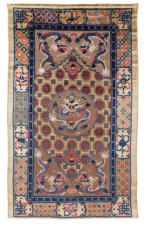 A Chinese silk and metal thread yellow ground 'five clawed dragon' carpet, Qing dynasty, 19th century. (Measure 208x126).
