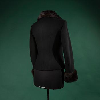 A jacket by MOSCHINO, in size 44(IT).