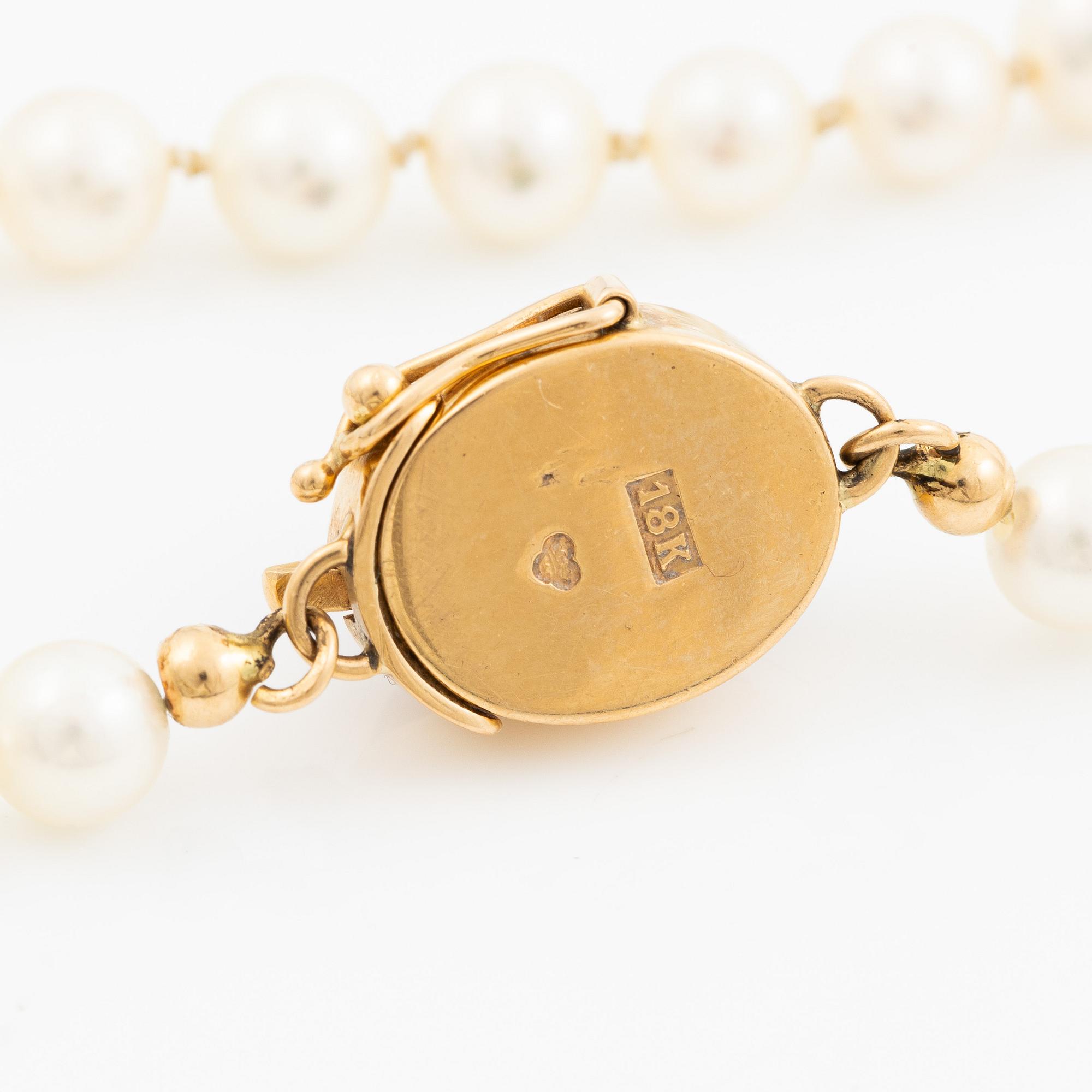 Collier odlade pärlor lås 18K guld med en cabochonslipad ametist.