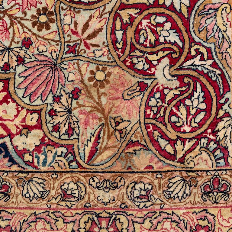 An antique Kerman Laver carpet, south east persia, ca 501 x 359 cm.