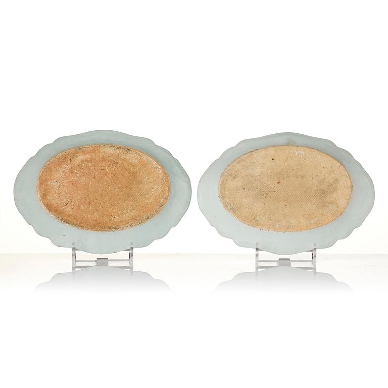 A group of famille rose 'double peacock' serving dishes, Qing dynasty, Qianlong (1736-95). (8 pieces).