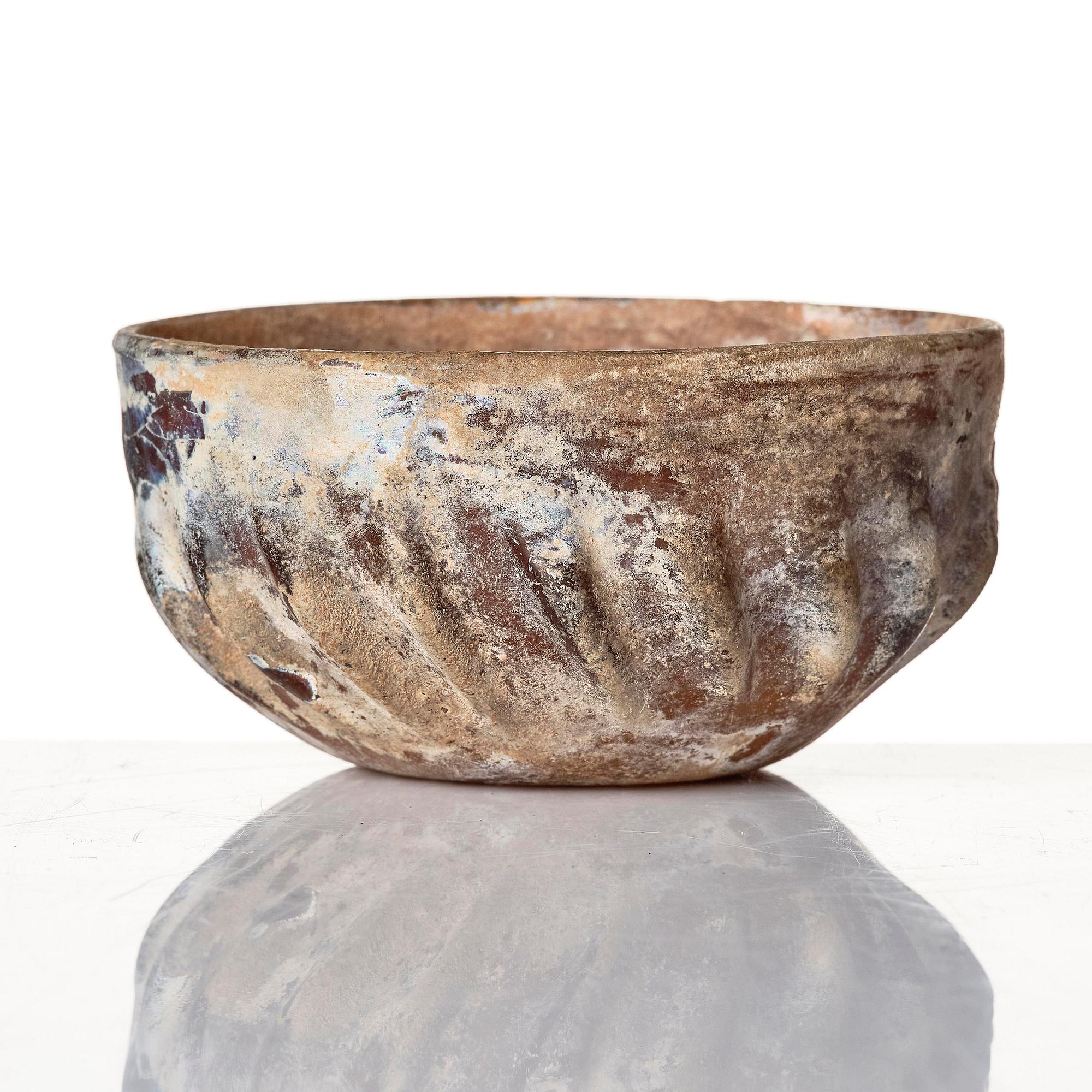 A mould-blown glass bowl, probably Iran, circa 12-13th century.