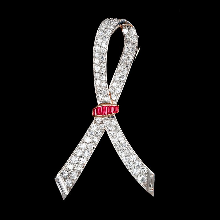 A platinum, ruby and diamond brooch, tot. app. 3.50 cts, 1930's.