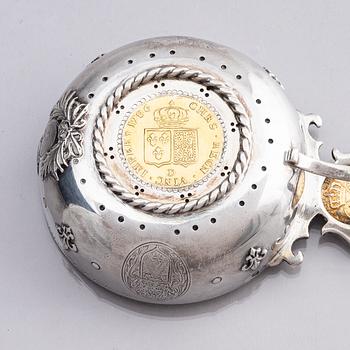 An 18th century French parcel-gilt silver tasse du vin (wine taster).