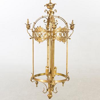A 20th century brass ceiling lamp in Louis XV-style.