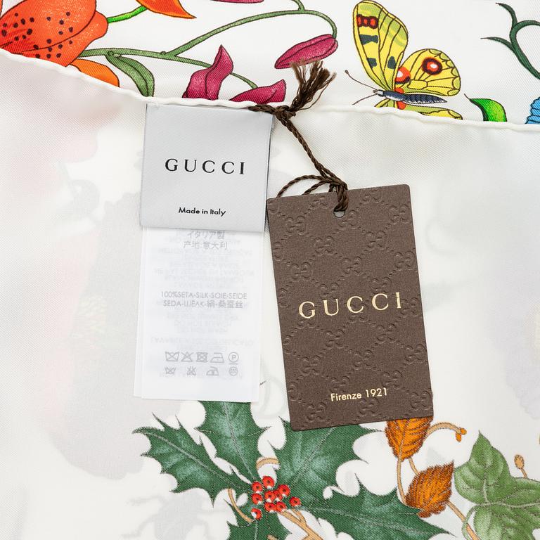 Gucci, a 'Flora' silk scarf.