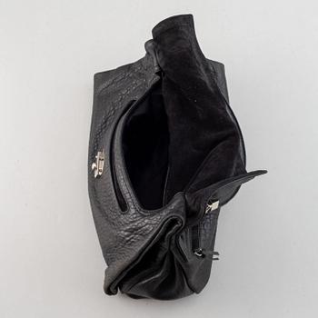 Yves Saint Laurent, a black leather bag.