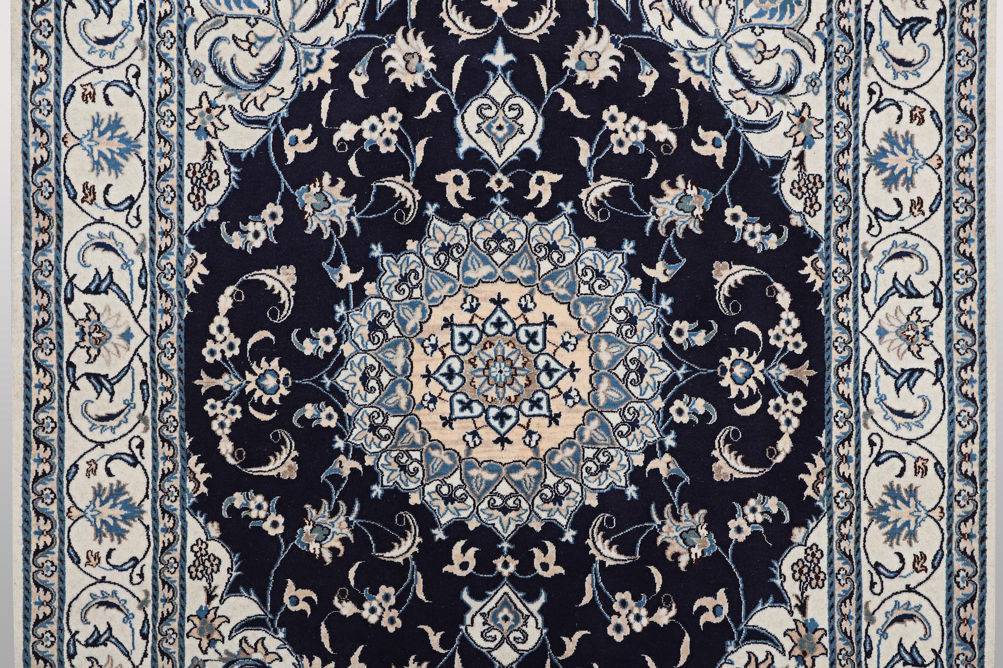A carpet, Nain, part silk, ca 256 x 199 cm.