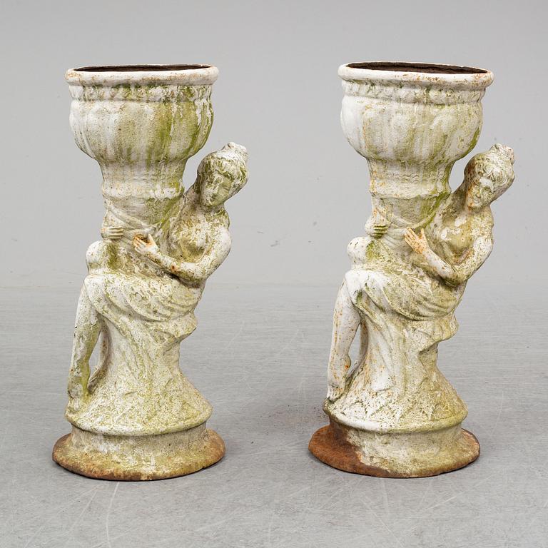 An end of the 20th Century pair of cast  iron flower pots.