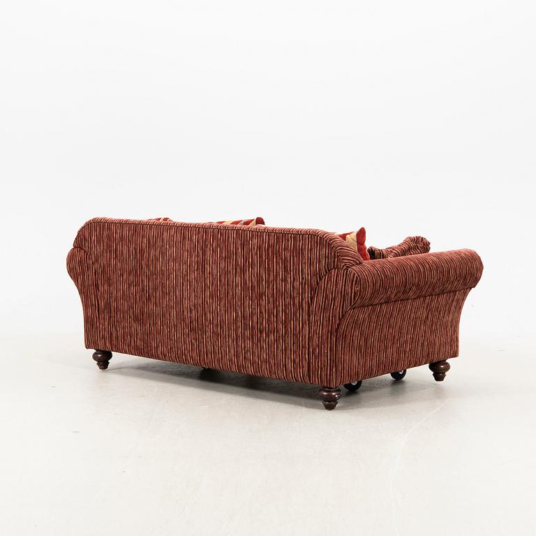 A sofa,with pillows. later part of the 20th Century.