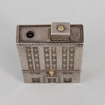 A Tiffany & Co. silver cigarette-lighter, marked London 1970.