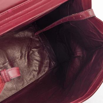 Cartier, A red suede vintage weekendbag.