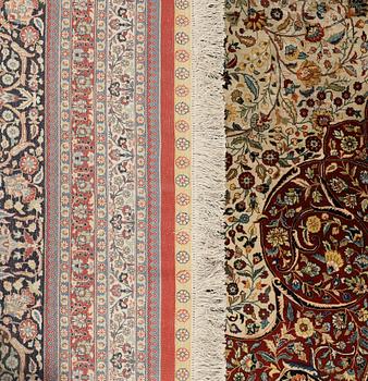 An Oriental silk carpet, c. 436 x 306 cm.