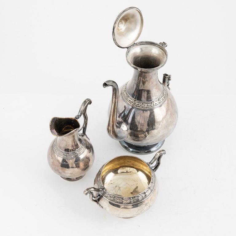 A Swedish Silver Coffee Pot, Creamer and Sugar Bowl, marks of GAB, Stockholm 1875-1897, and GT Folcker 1875.