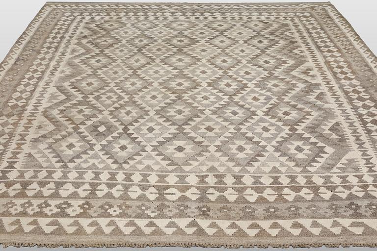 A Kilim rug, approx. 294 x 250 cm.