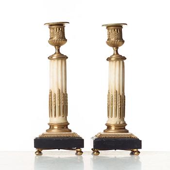 A pair of Louis XVI candlesticks.