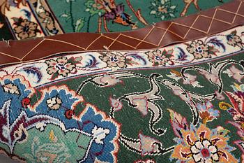 A rug, old Esfahan, part silk, signed, ca 225 x 149 cm (ca 1,5-2,5 cm flat weave at the ends).