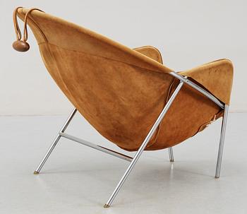 An Erik Ole Jörgensen leather and chromed steel lounge chair.