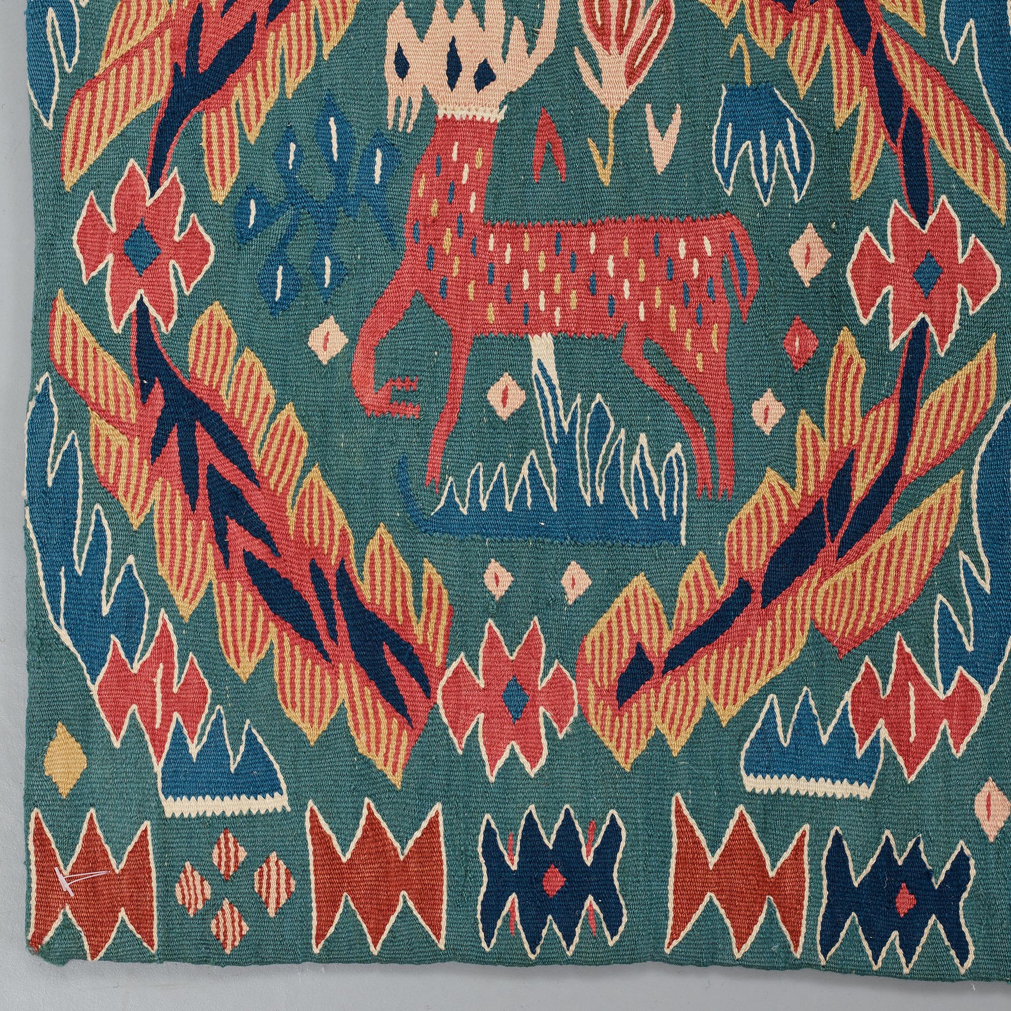 A CARRIAGE CUSHION, tapestry weave, "Kungahjorten", ca 50 x 104,5 cm, Scania (Sweden),