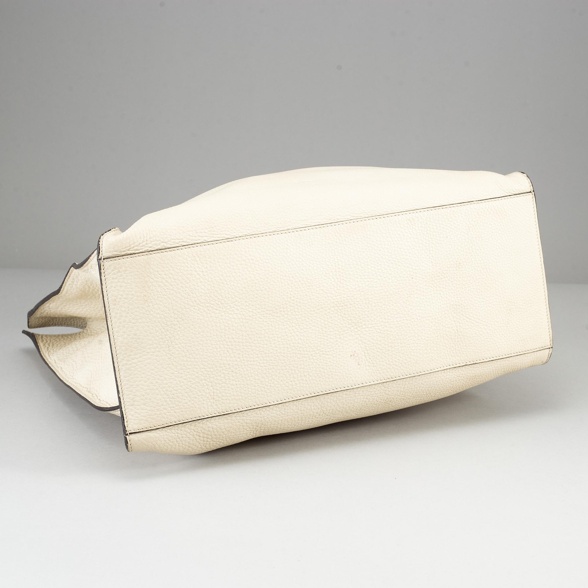 GUCCI, a white leather tote bag with bamboo handles.