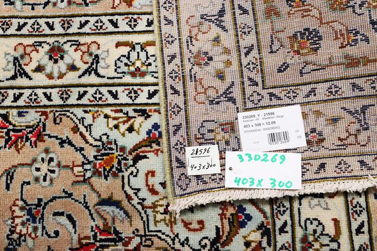 A Kashan carpet, c. 403 x 300 cm.