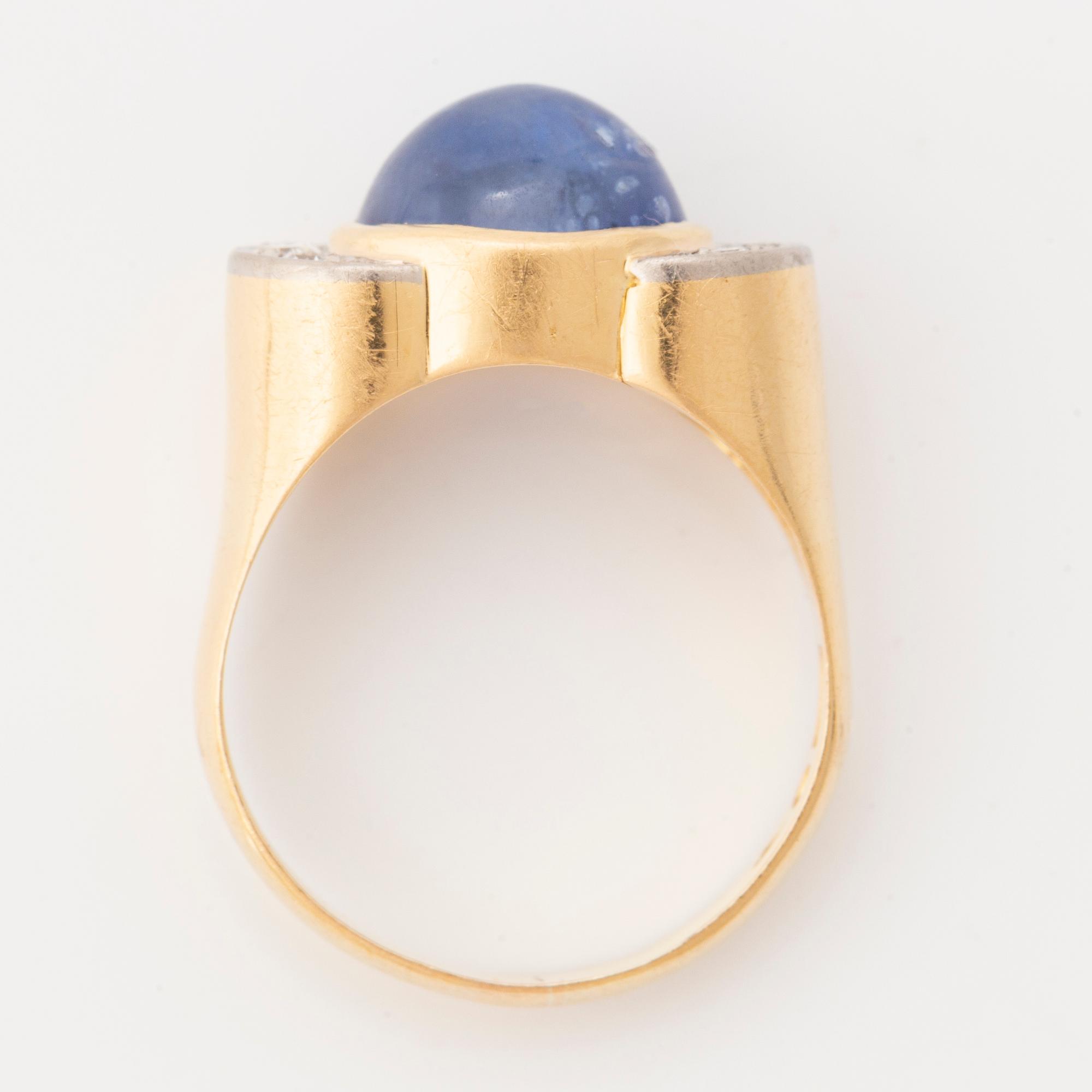 Cabochon cut sapphire and eight cut diamond ring.