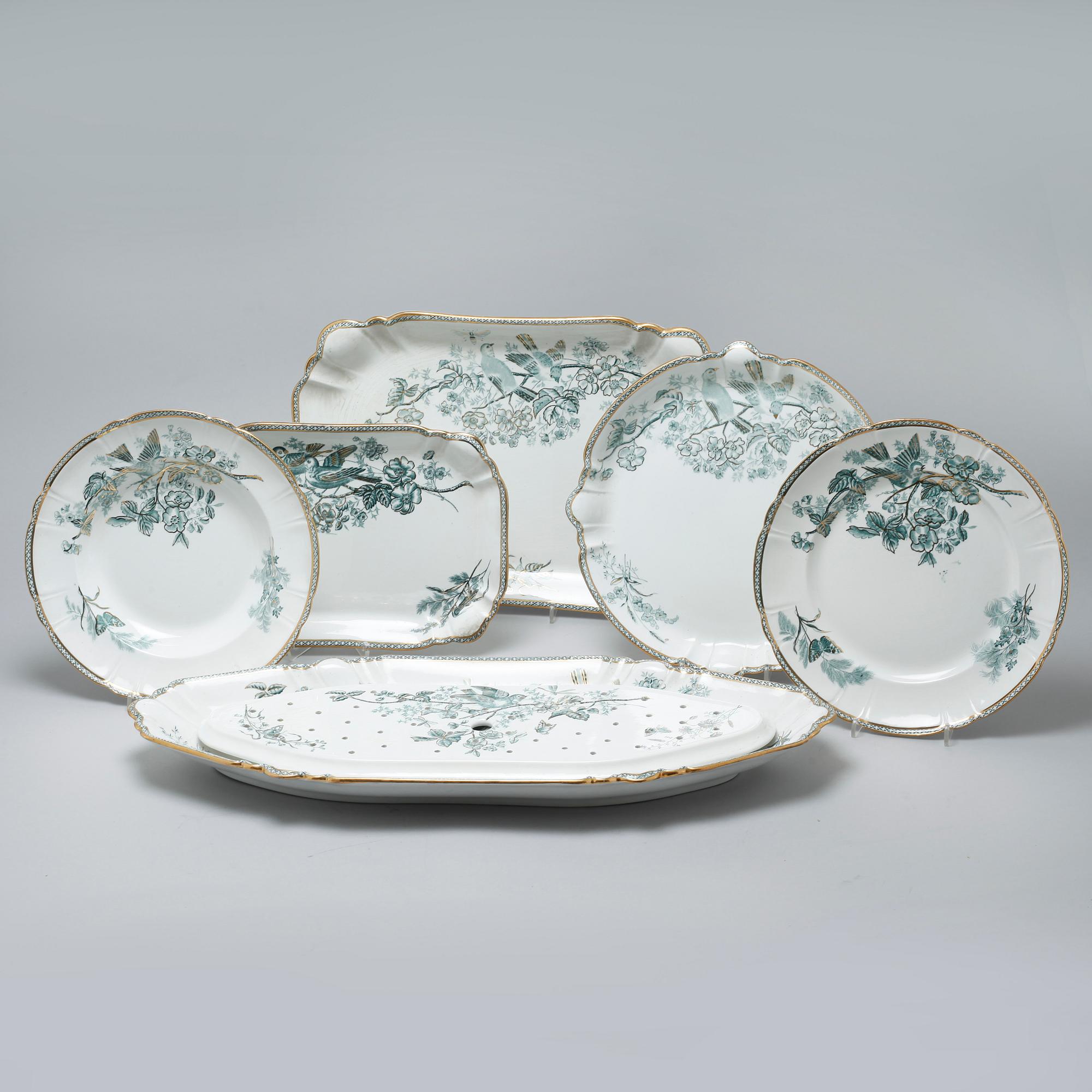 A earthenware table set of 136 pcs "Vexiö Guld",  by Arvid Ekberg, Gustafsberg, from around year 1900.