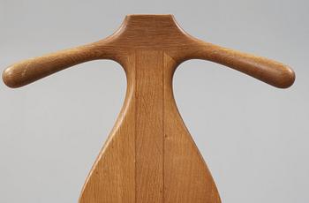 A Hans J Wegner 'Jakkens Hvile' teak chair, Johannes Hansen, Denmark.