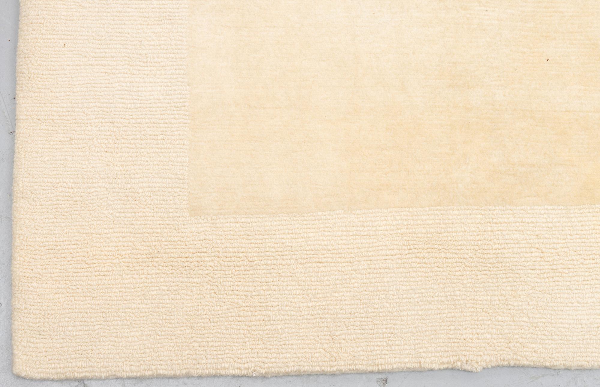 A carpet, knotted and loomed, ca 328 x 347 cm.