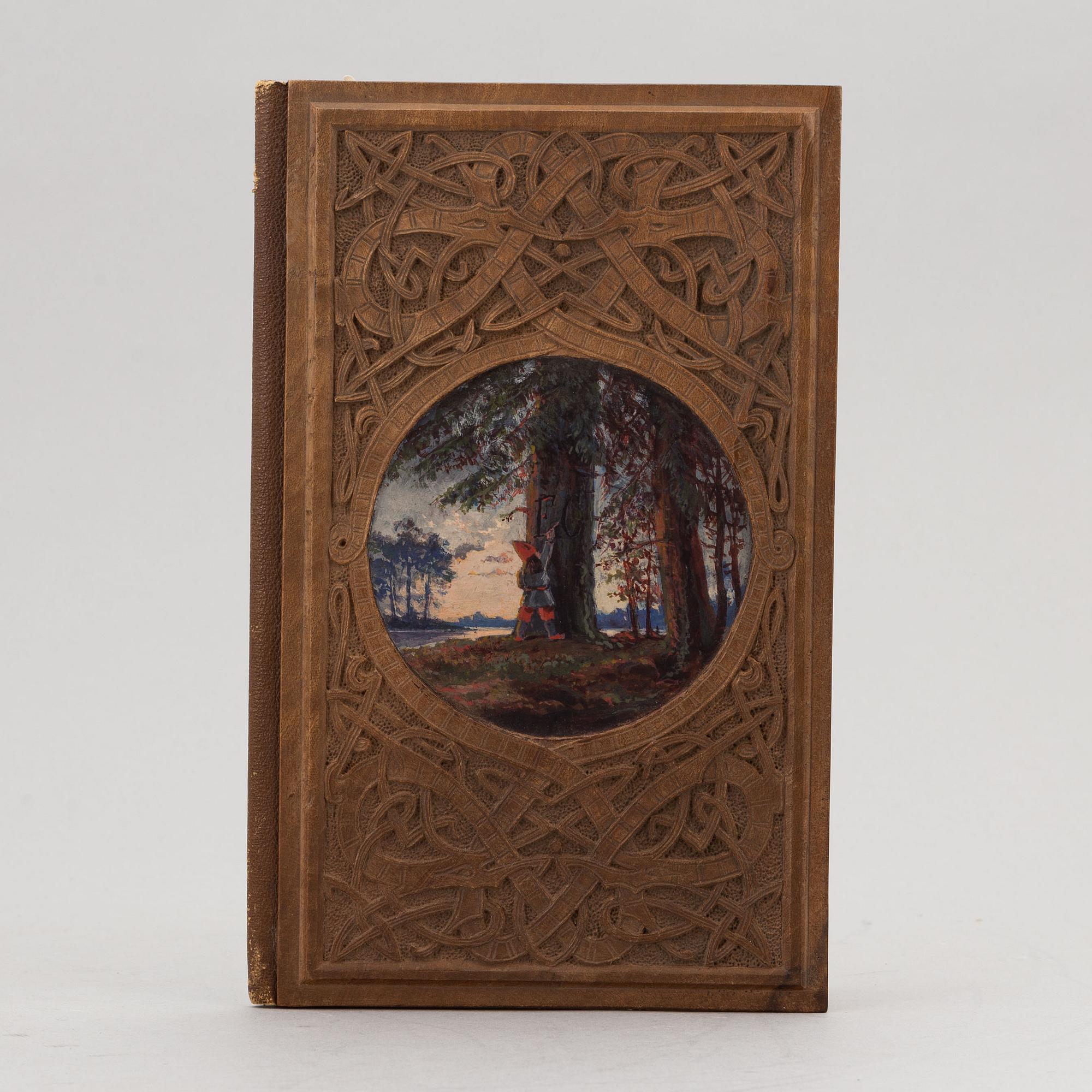 A keepsake book embellished by Ellen Jolin featuring a 'Santa Claus' figure.