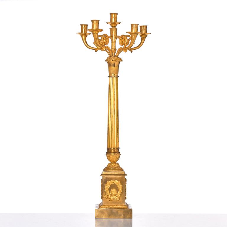 A French late Empire gilded six-light candelabra, mid 19th century.