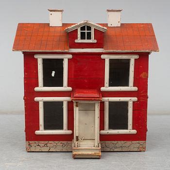 a dolls cabinet, dated 1940.