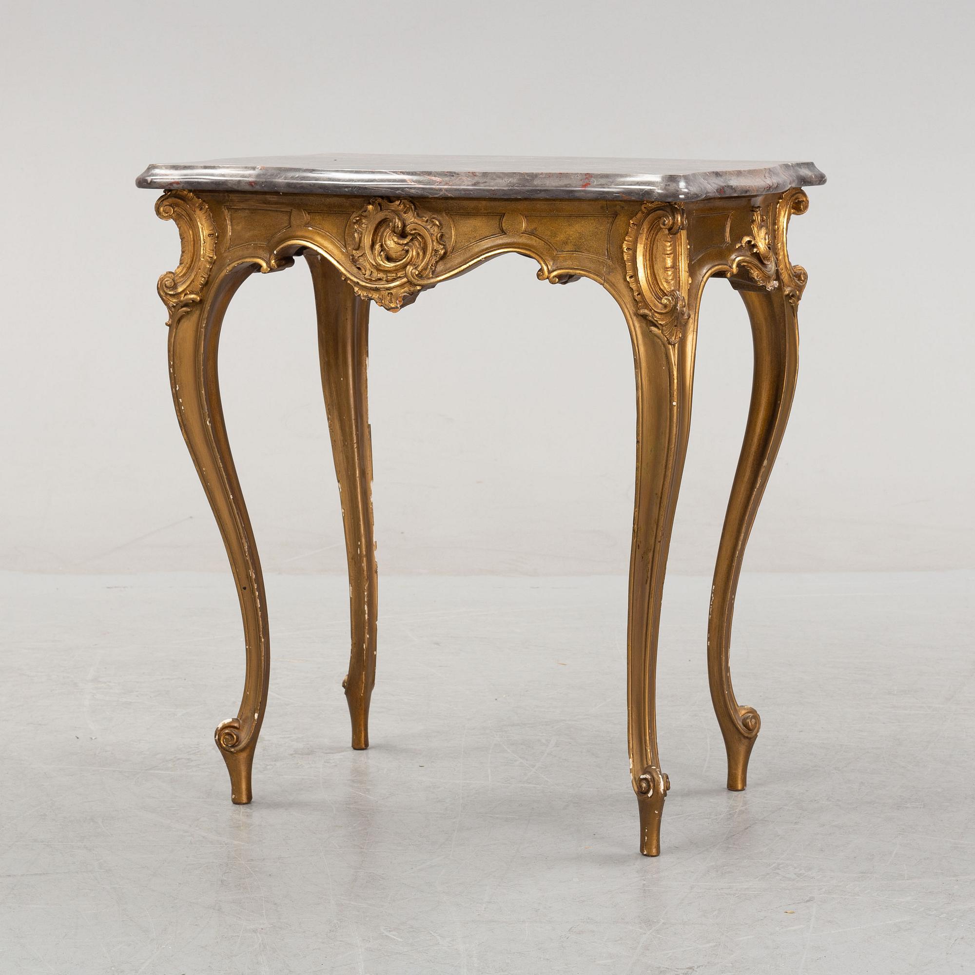 A rococo style table, around 1900.