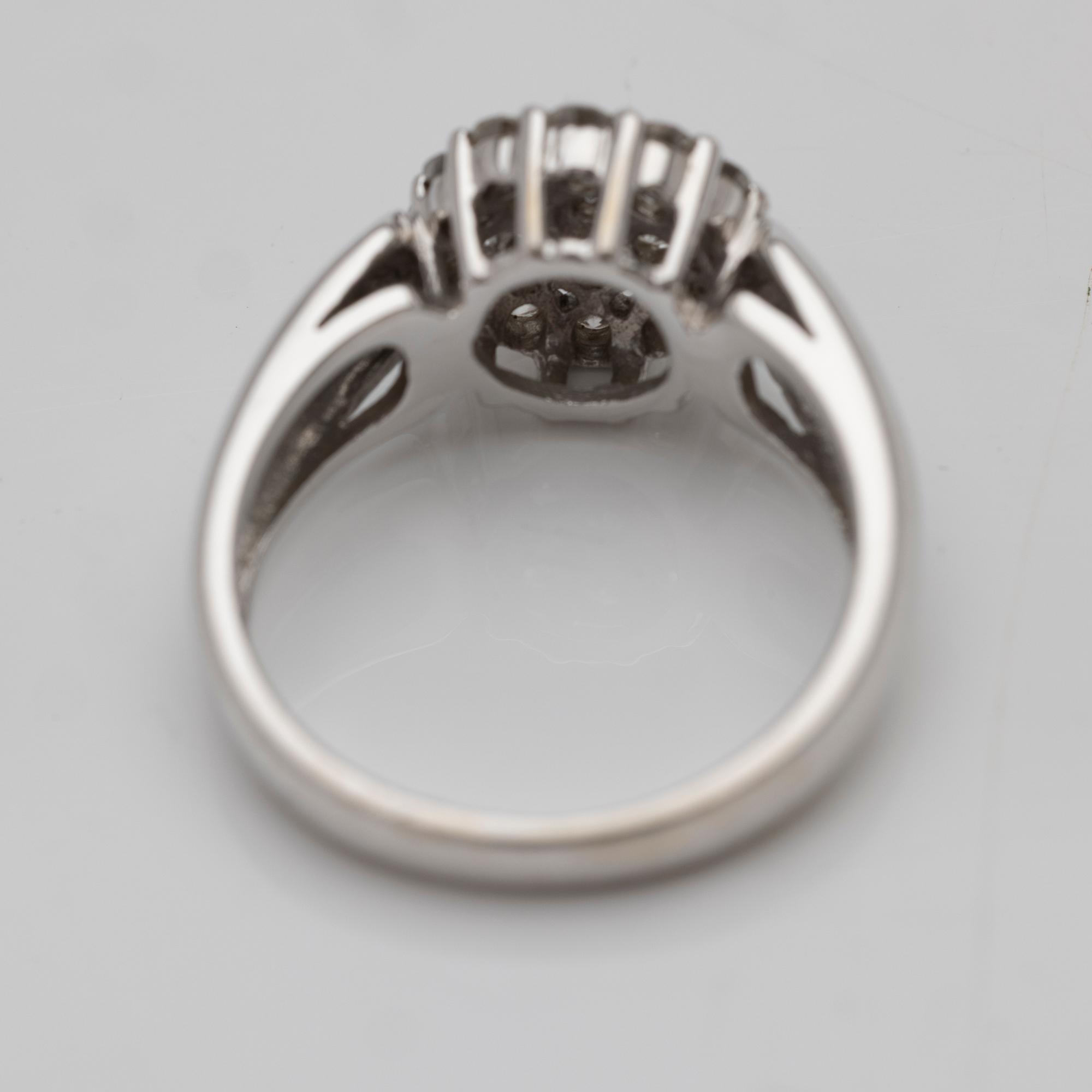 18K white gold ring with diamonds.