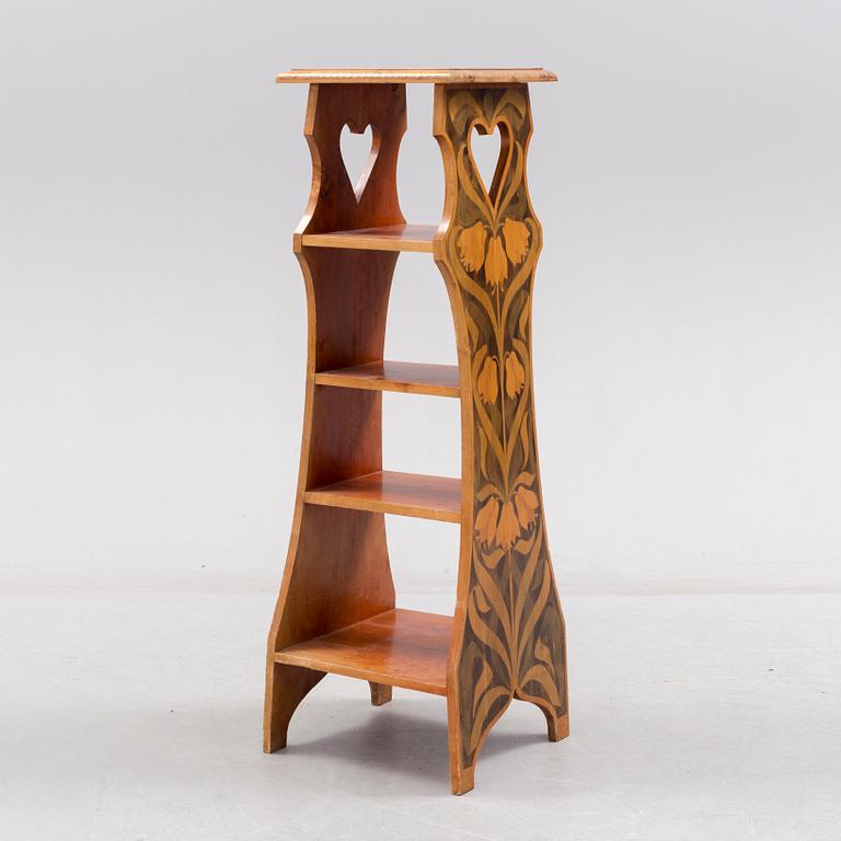 An early 20th century art nouveau shelf.