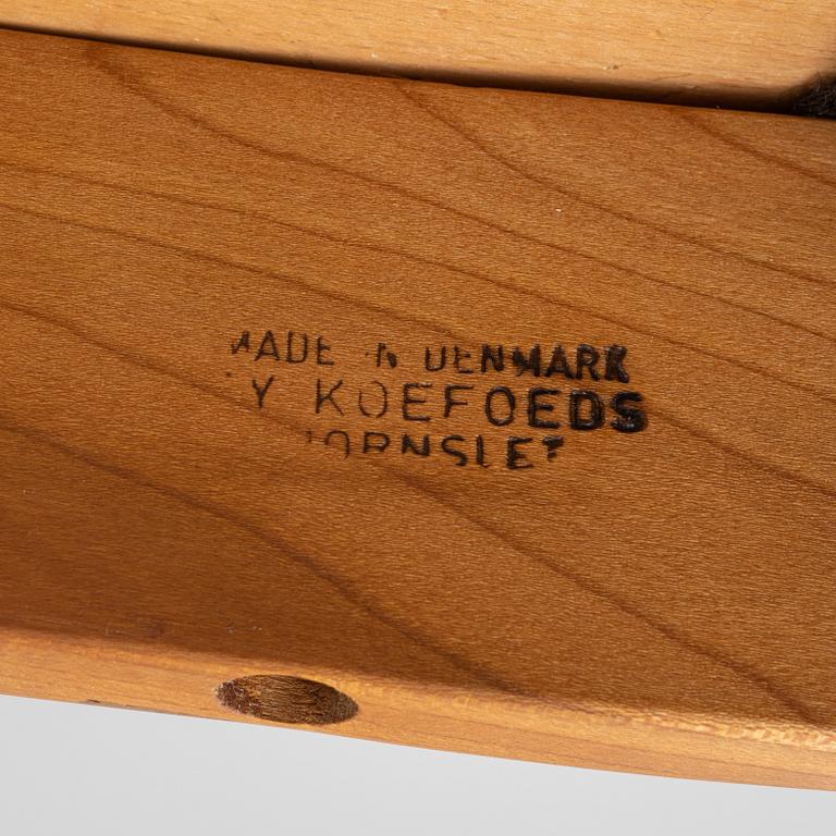 Niels Koefoed, eight teak dining chairs upholstered in new sheep skin, Denmark, 1960's.