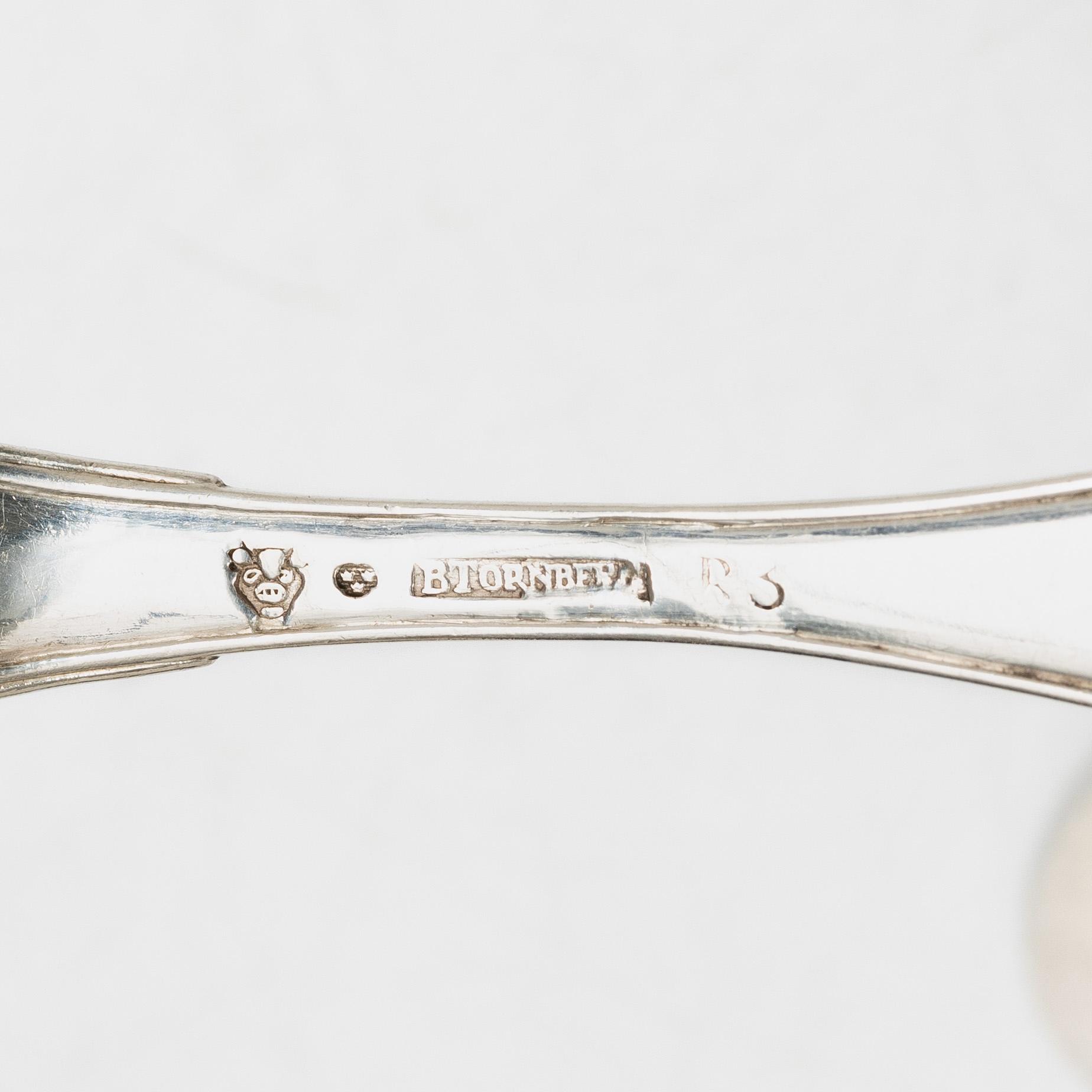 Bengt Törnberg, forks, 12 pcs, and Stephan Westerstråhle and Niklas Ramberg, spoons, a pair, early 19th century.