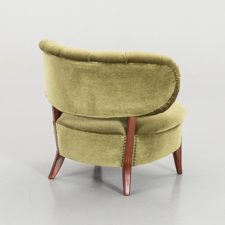 AN OTTO SCHULTZ LOUNGE CHAIR.