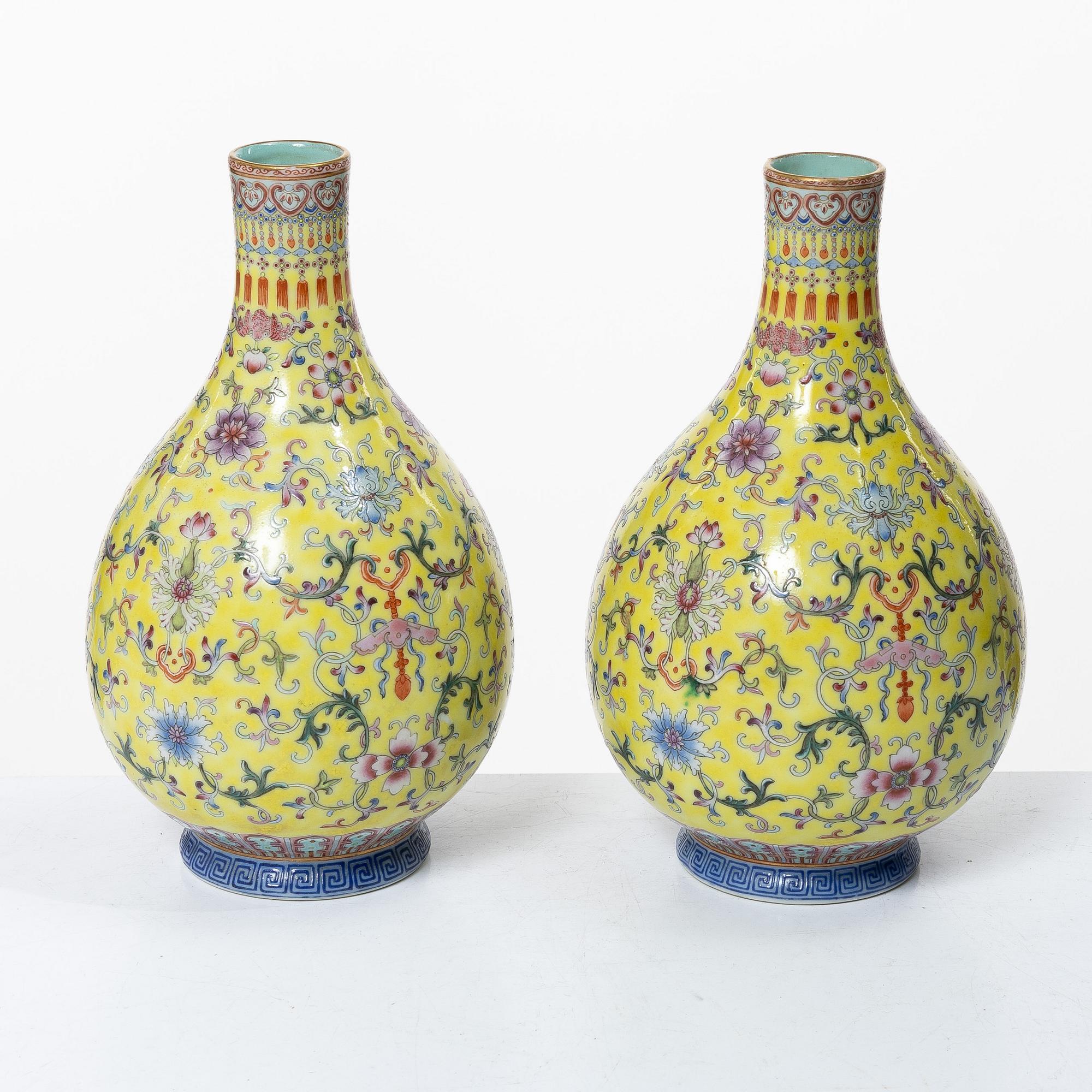 A pair of Chinese yellow ground porcelain vases, 1900s.