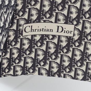 Christian Dior, a black canvas umbrella, toilet bag, coin purse and wallet.