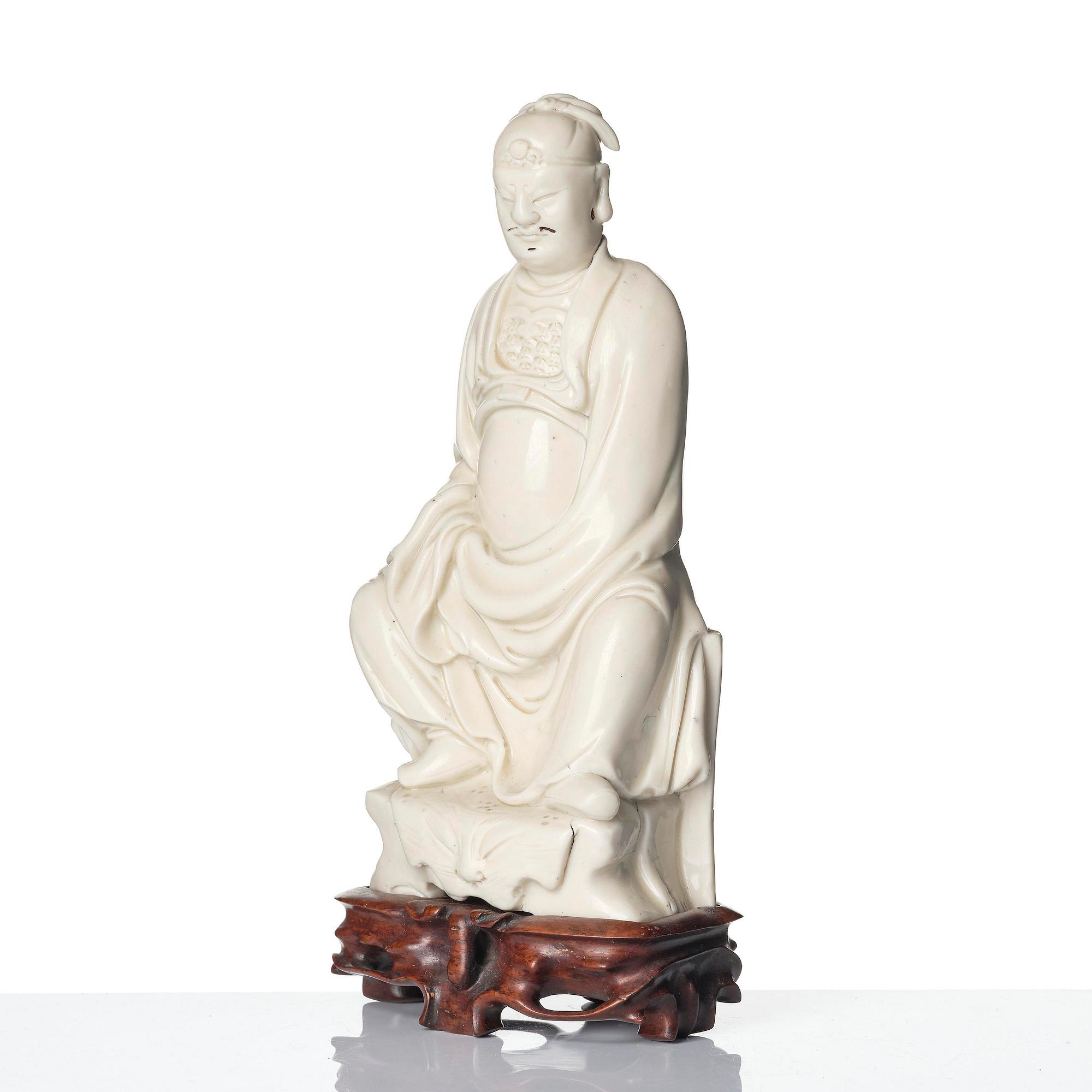 A blanc de chine figure of Guandi, Qing dynasty, 18th century.