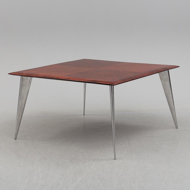 a dining table by Philippe Starck, "M Serie Lang", Driad.