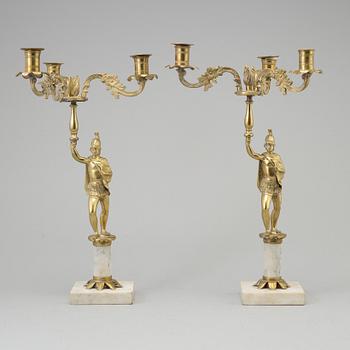 A pair of brass and marble candelabra, early 20th century with older parts.