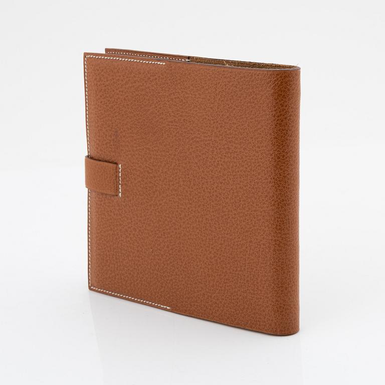 Hermès, a whisky leather notebook/agenda.