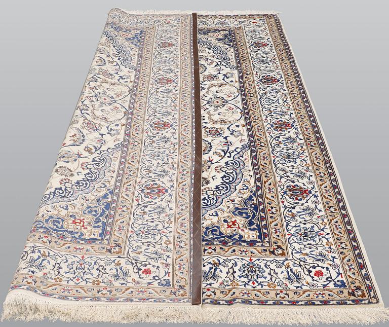 A carpet, Nain Part silk, 312 x 207 cm.