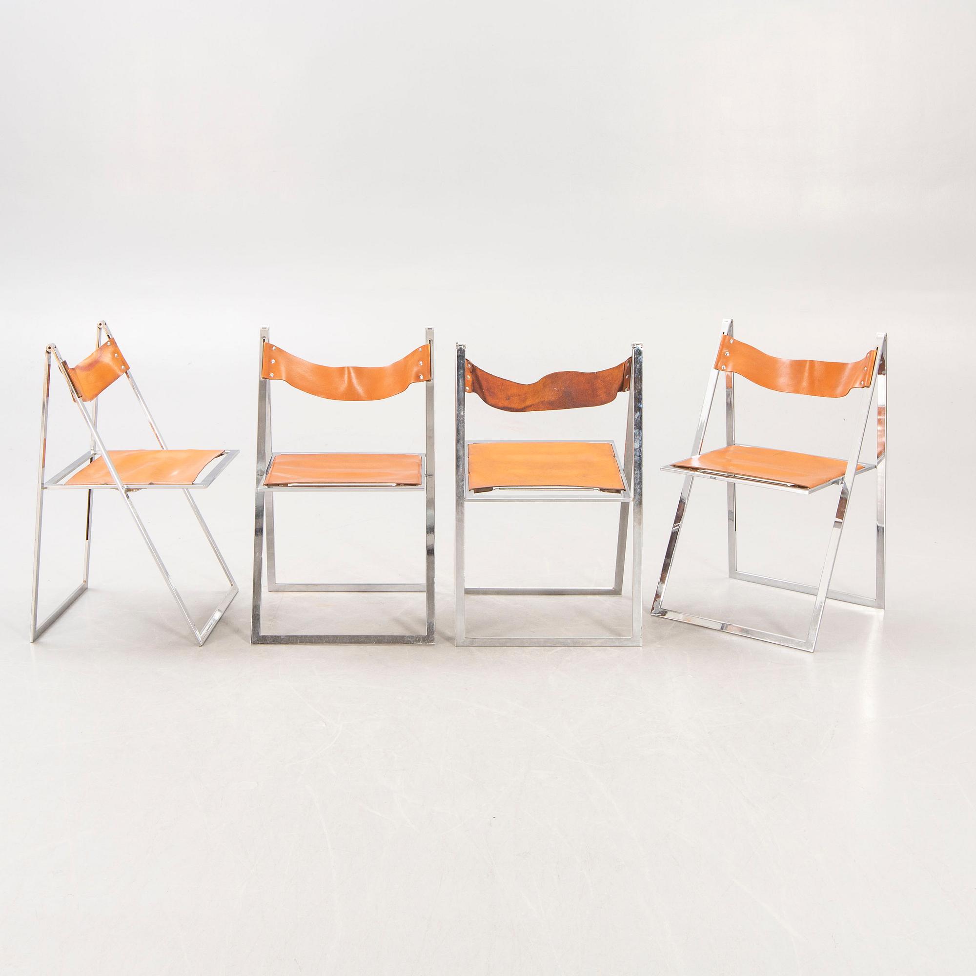 A set f four Fontoni & Geraci leather and chrome folding chairs