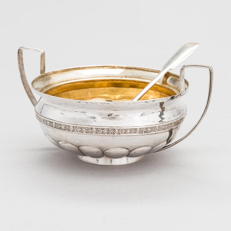 A silver sugar bowl, 1825 and a Hlebnikov silver spoon, early 1900s, both from Moscow.