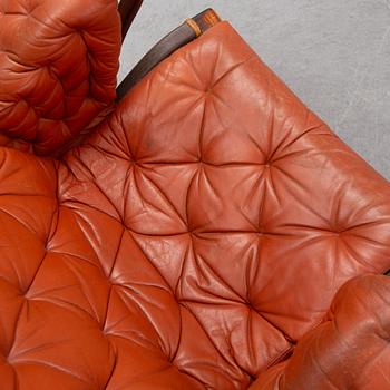 An end of the 20th Century pair of 'Pernilla' easy chairs with leather upholstery by Bruno Mathsson for DUX.