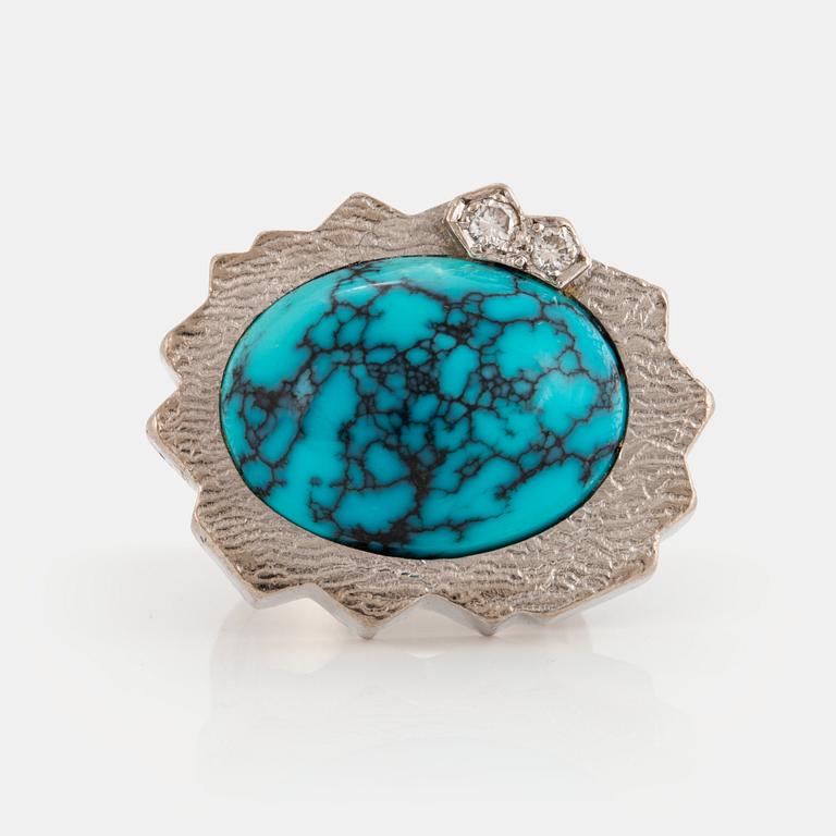 A Grima ring in 14K white gold set with a turquoise and round brilliant-cut diamonds.