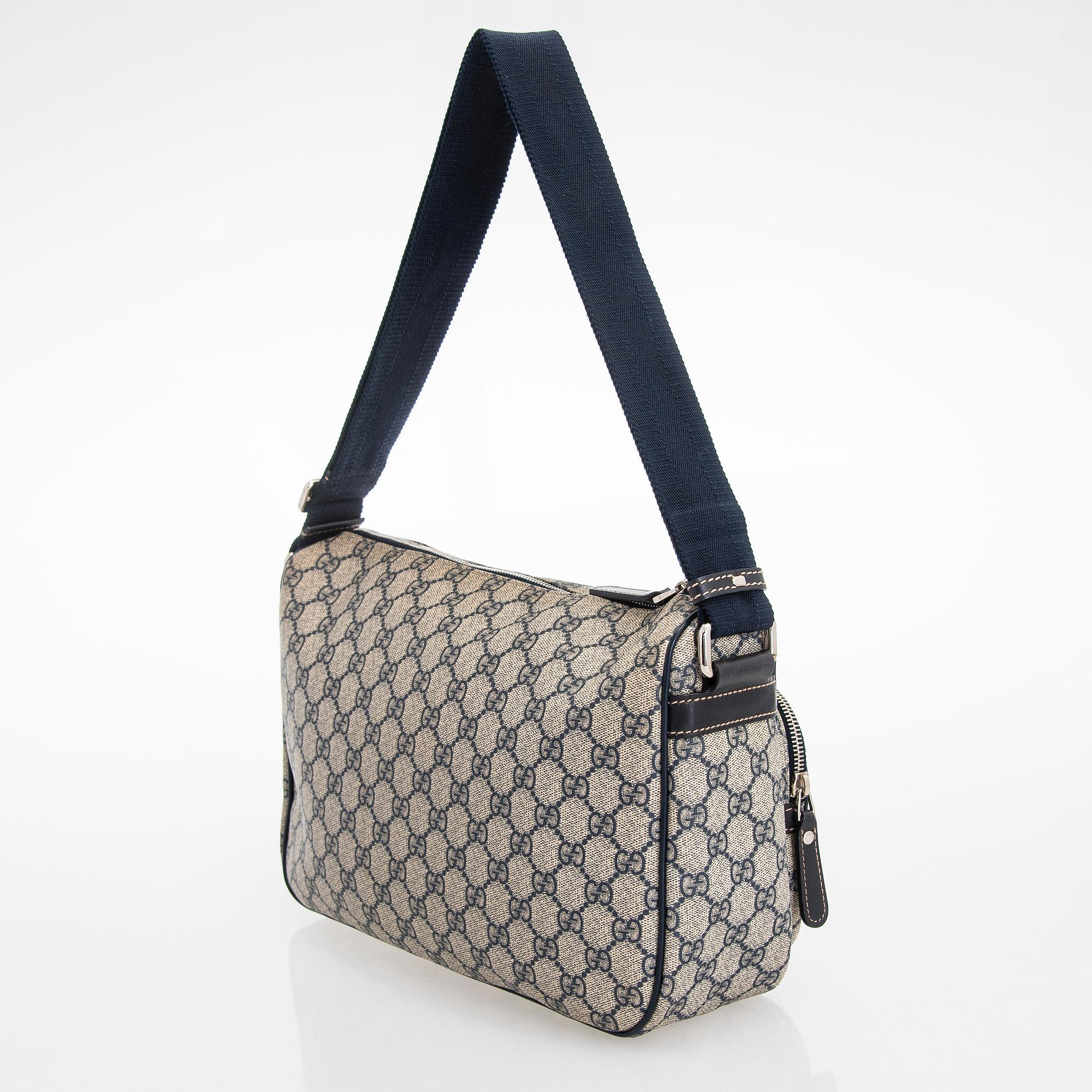 Gucci, A "GG Supreme messenger" bag.